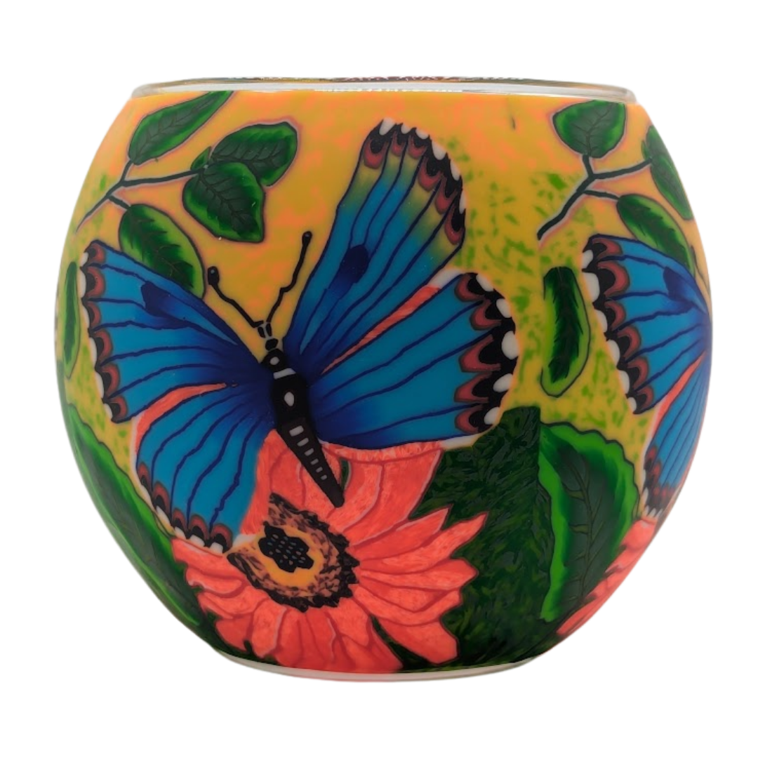 Decorative globe with butterfly and floral design on a white background