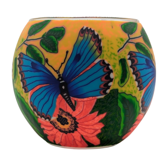 Decorative globe with butterfly and floral design on a white background