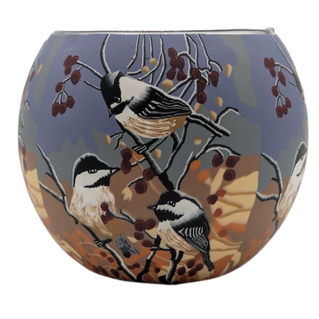 Decorative glass globe with Chickadees on it.