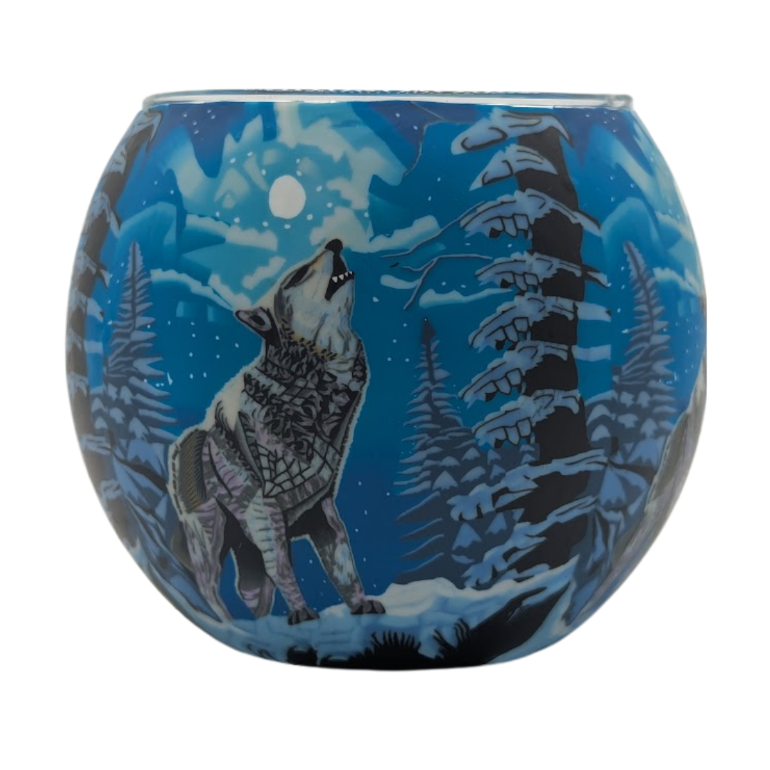 Glass globe with a wolf howling at the moon design on a blue background