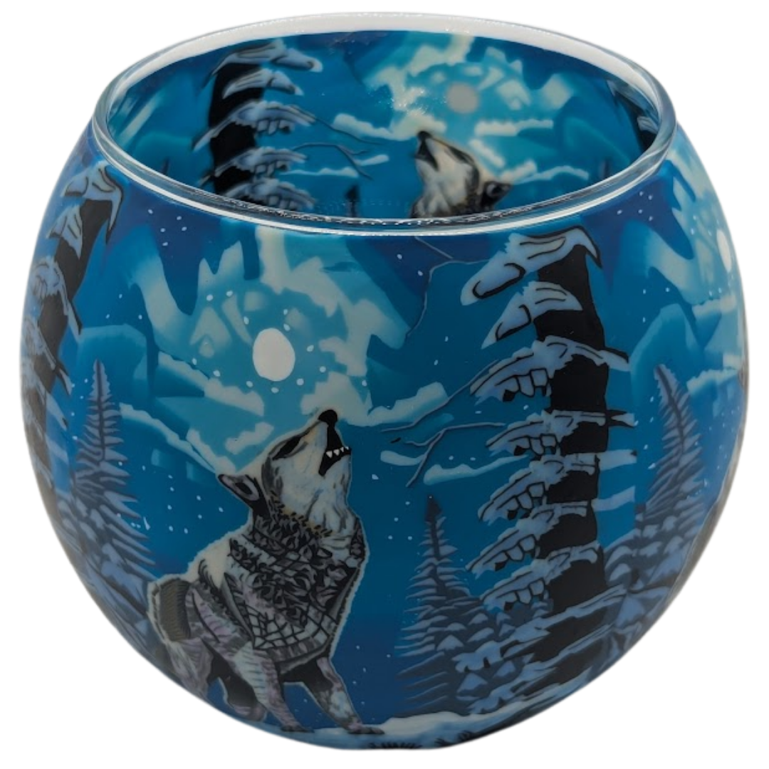 Glass globe with wolf design against a blue night sky