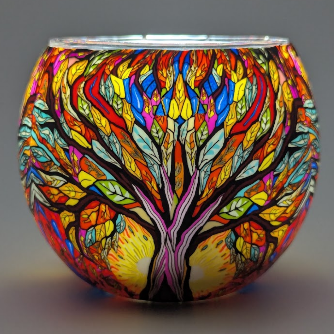 Colorful glass globe with tree-of-life design on a gray background
